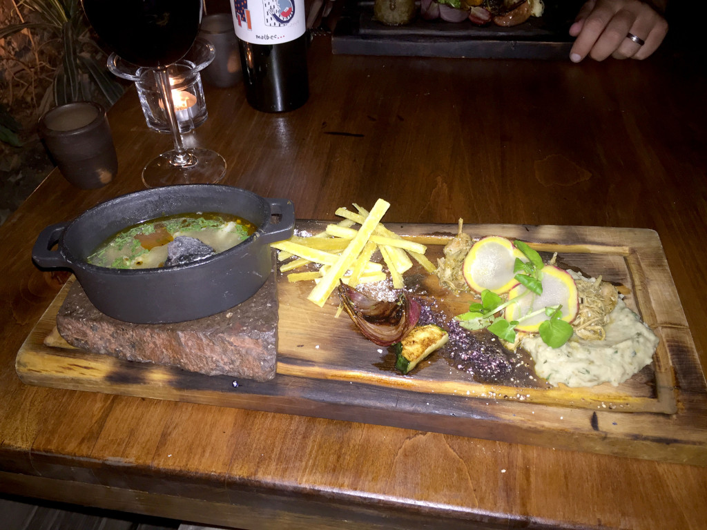 Rabbit atop a puree, possibly of white beans, with a native spice and fried yucca, grilled veggies, and potato. Served with a soup of hen, llama, horse and Chiapeño corn. A hot volcanic rock was on the dish which was then dropped into the soup to heat it; it got pretty steamy!