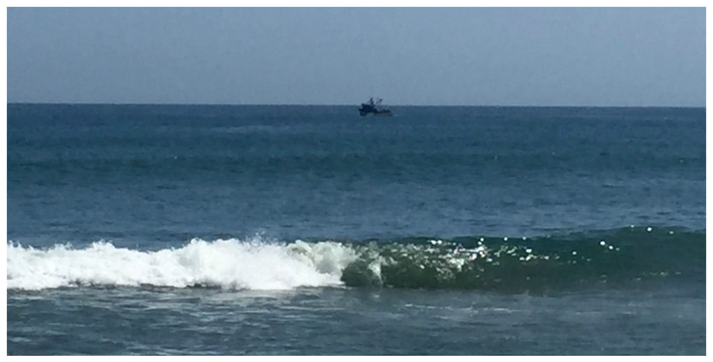 We've seen this boat, one of many move along las pocitas with what looks like a giant net (or trawler?) behind it. 