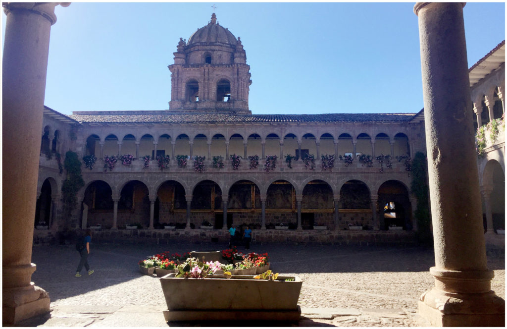 View of the courtyard from the back - can see the church building. The Inca stonework is on either side of the courtyard.